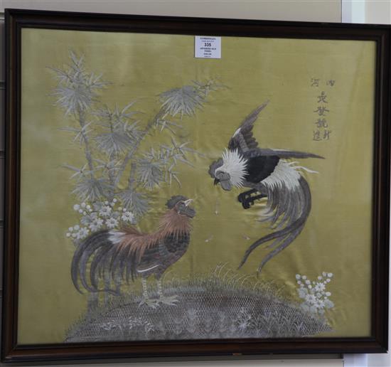 A Japanese embroidered silk panel of two fighting cockerels, 45 x 55cm.